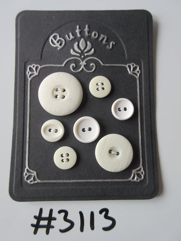 #3113 Lot of 7 Mixed Off White Buttons