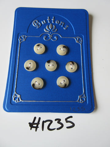 No.1235 Lot of 7 Cream and Black Buttons