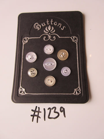 No.1239 Lot of 7 Mixed Clear and Beige Clear Buttons