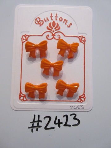 #2423 Lot of 5 Orange Bow Shaped Buttons